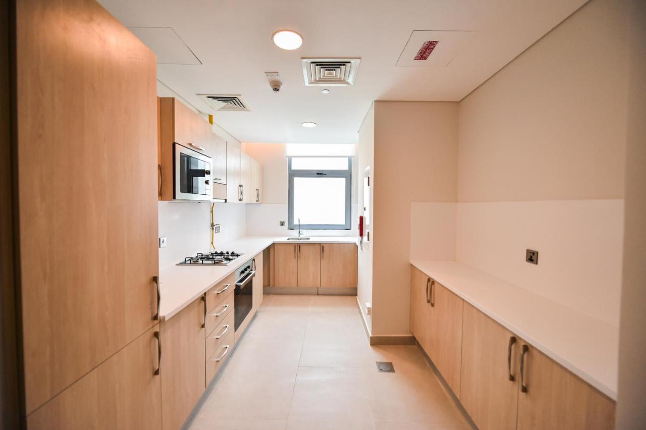 Waterfront Hotel Apartment Lusail Ngoại thất bức ảnh A typical kitchen in a student flat